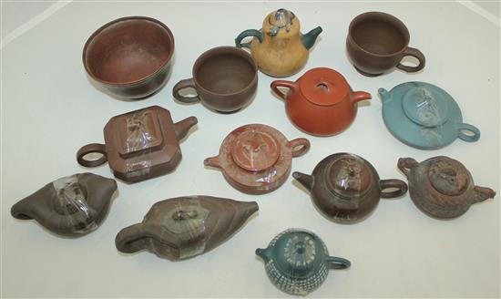 Ten Yixing pottery teapots and covers, two cups and a bowl, 20th century, 5.8cm
